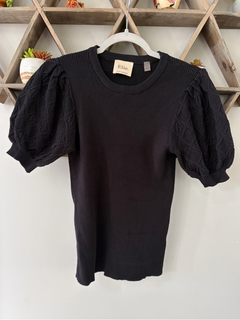 Elie Tahari black ribbed sweater with embroidered puff sleeves. Size medium.